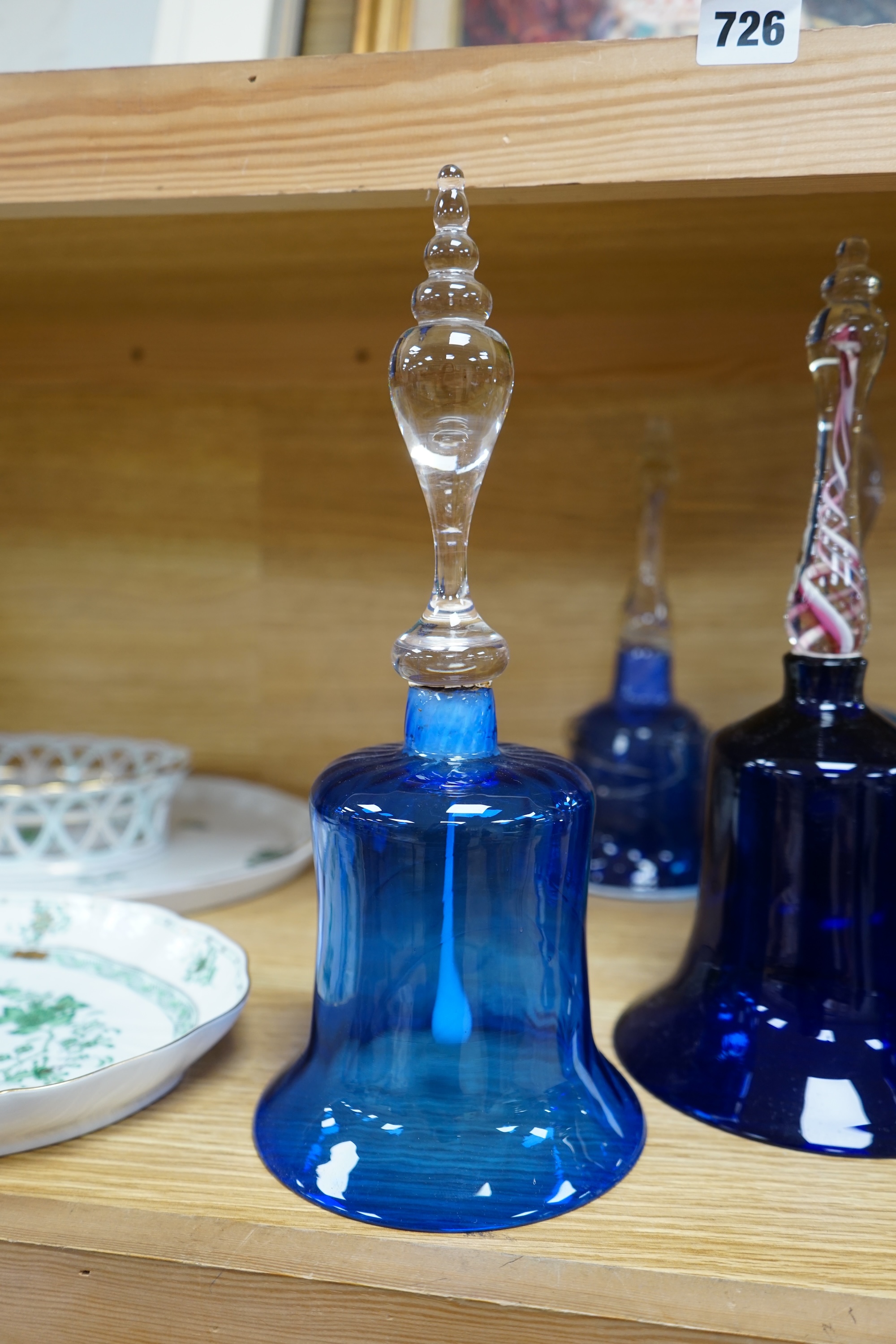 Five Victorian blue glass bells, two with air twist handles, 32cm high. Condition - fair to good